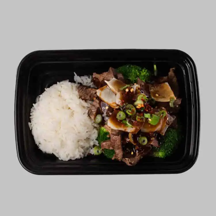 Flank steak cooked with a sweet & salty sauce, broccoli, onion, scallions and a side of steamed white rice.