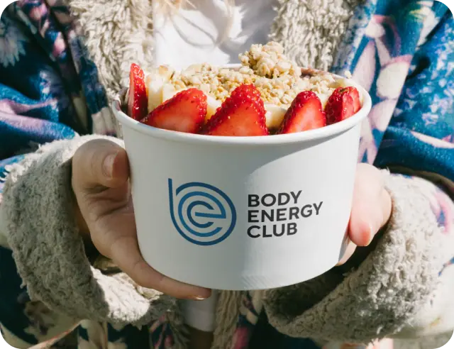 A person holding a healthy superfood acai bowl.
